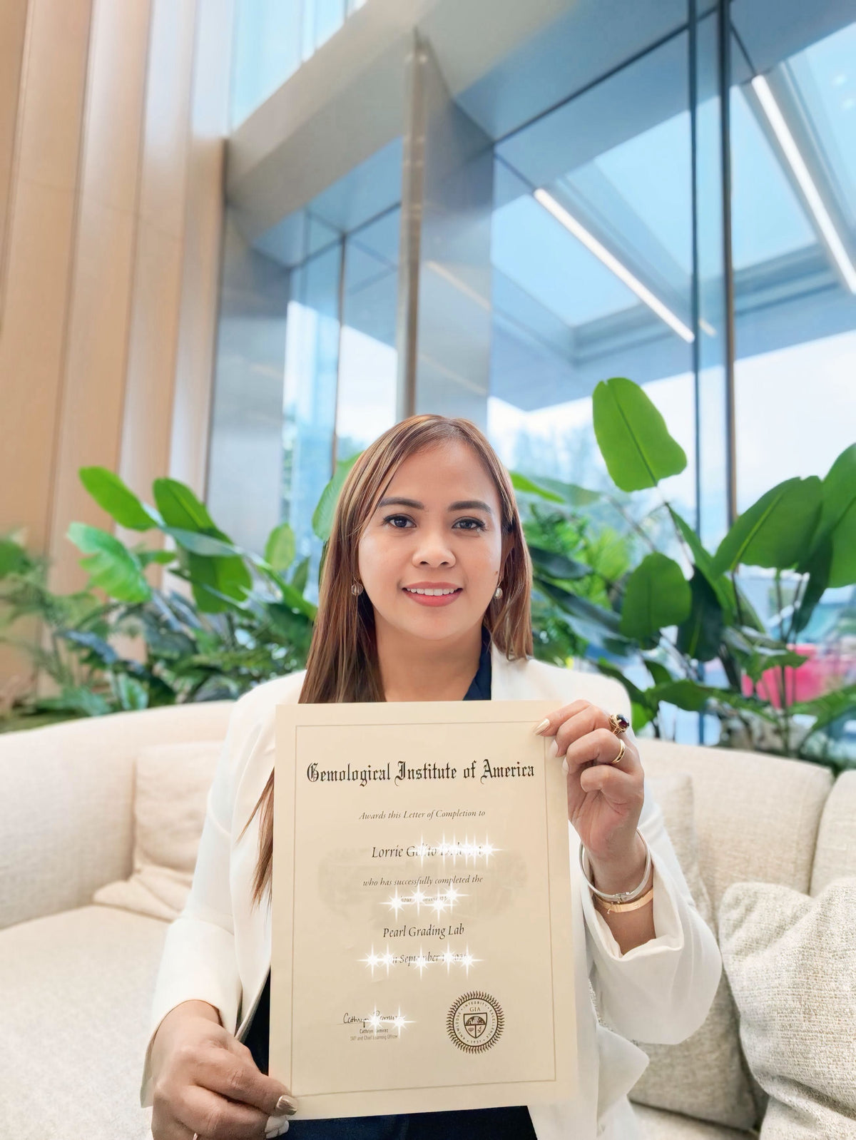 L’s Pearls CEO Ms. L holding her GIA Pearl Grading Lab completion letter