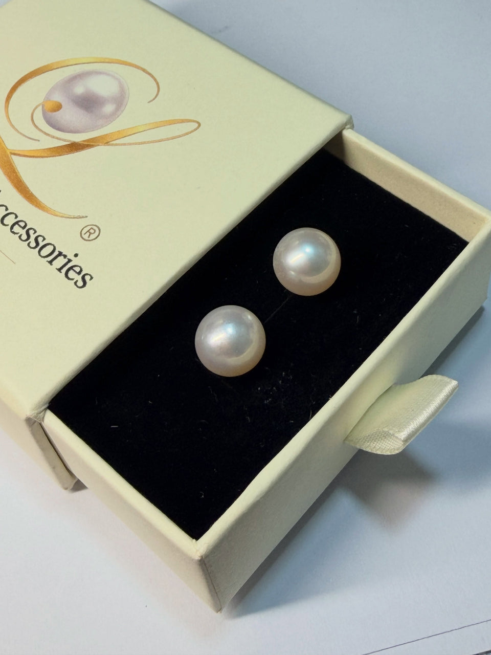 11mm White South Sea Pearls with a beautiful pinkish overtone, set in elegant micro-plated stud earrings