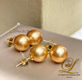 A pair of golden South Sea pearl Philippines stud earrings set in 14k gold